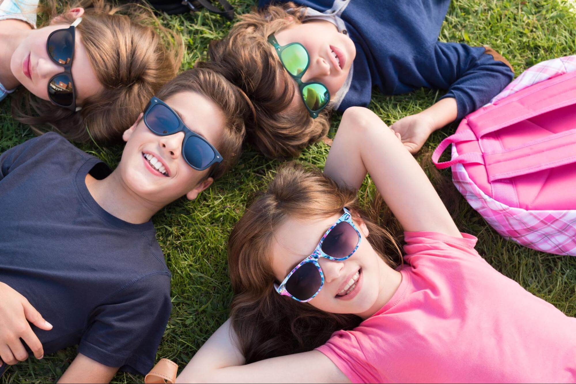 kids wearing solar eclipse glasses