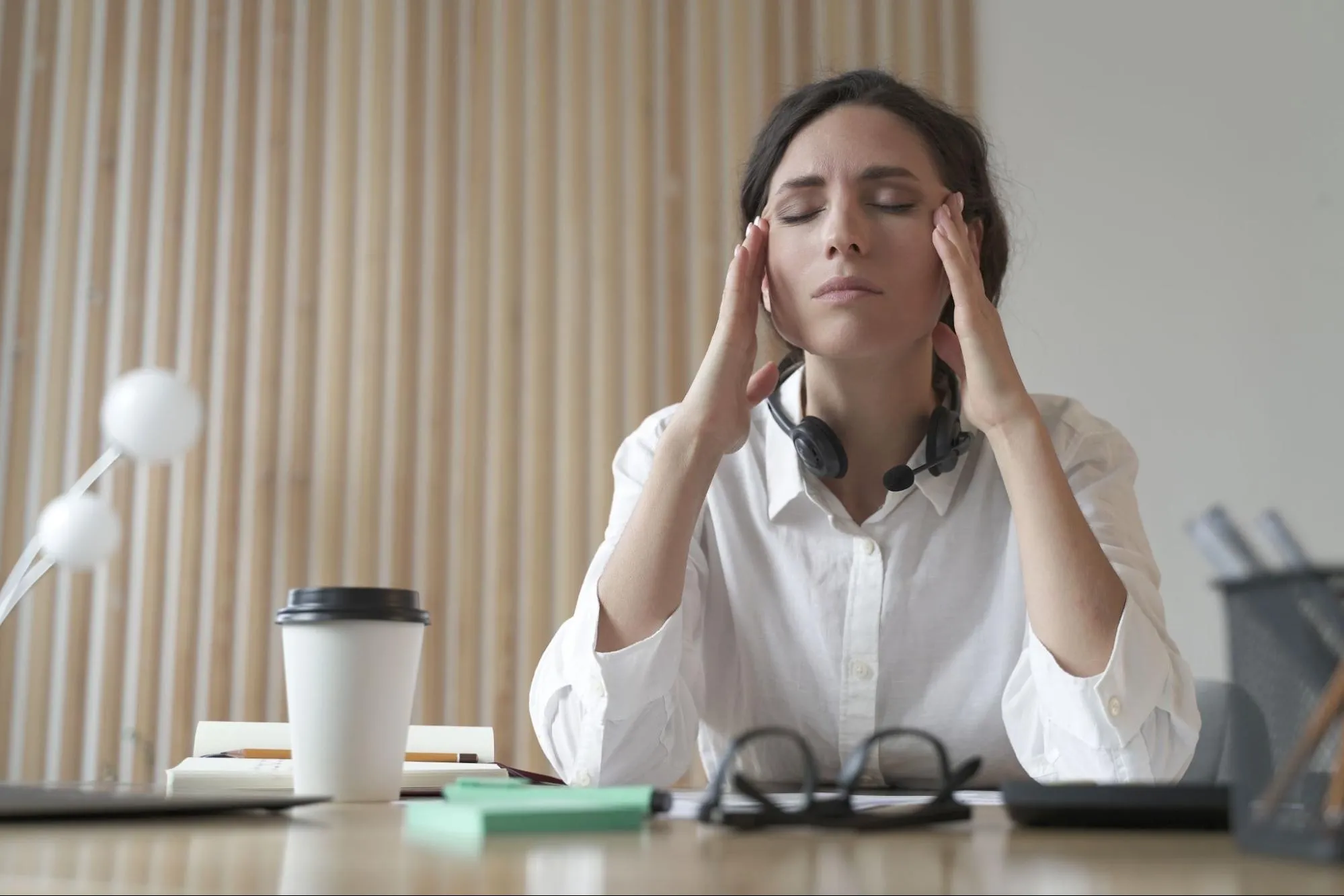 woman thinking why does my eye keep twitching