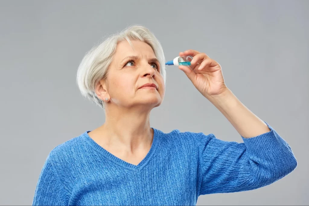 woman using eye drops for glaucoma